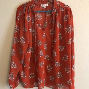 Orange floral blouse